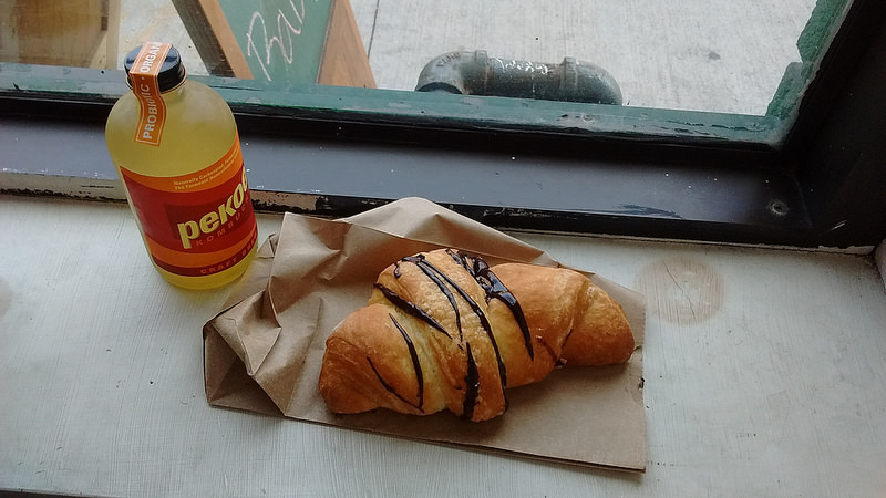 croissant and kombucha