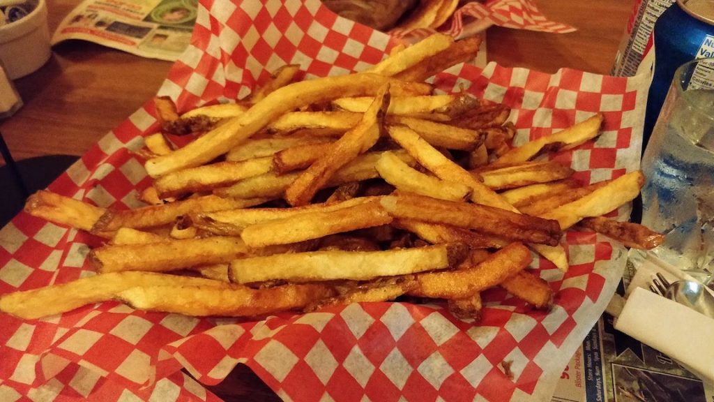 fries in a bowl lined with red and white checkerboard print paper